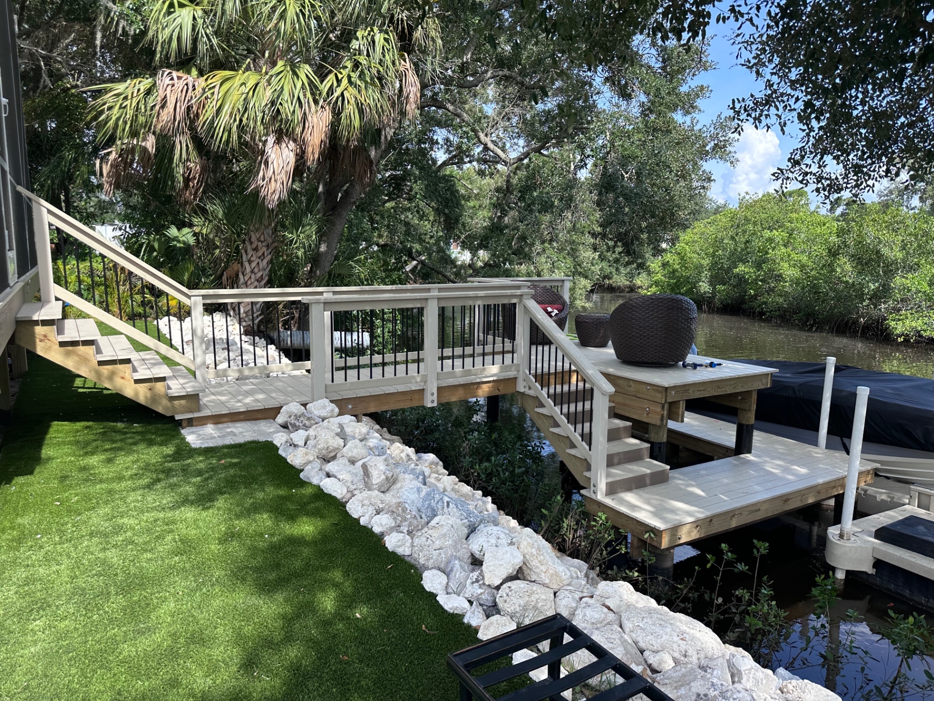 Elevated dock with stairs and rip-rap shoreline