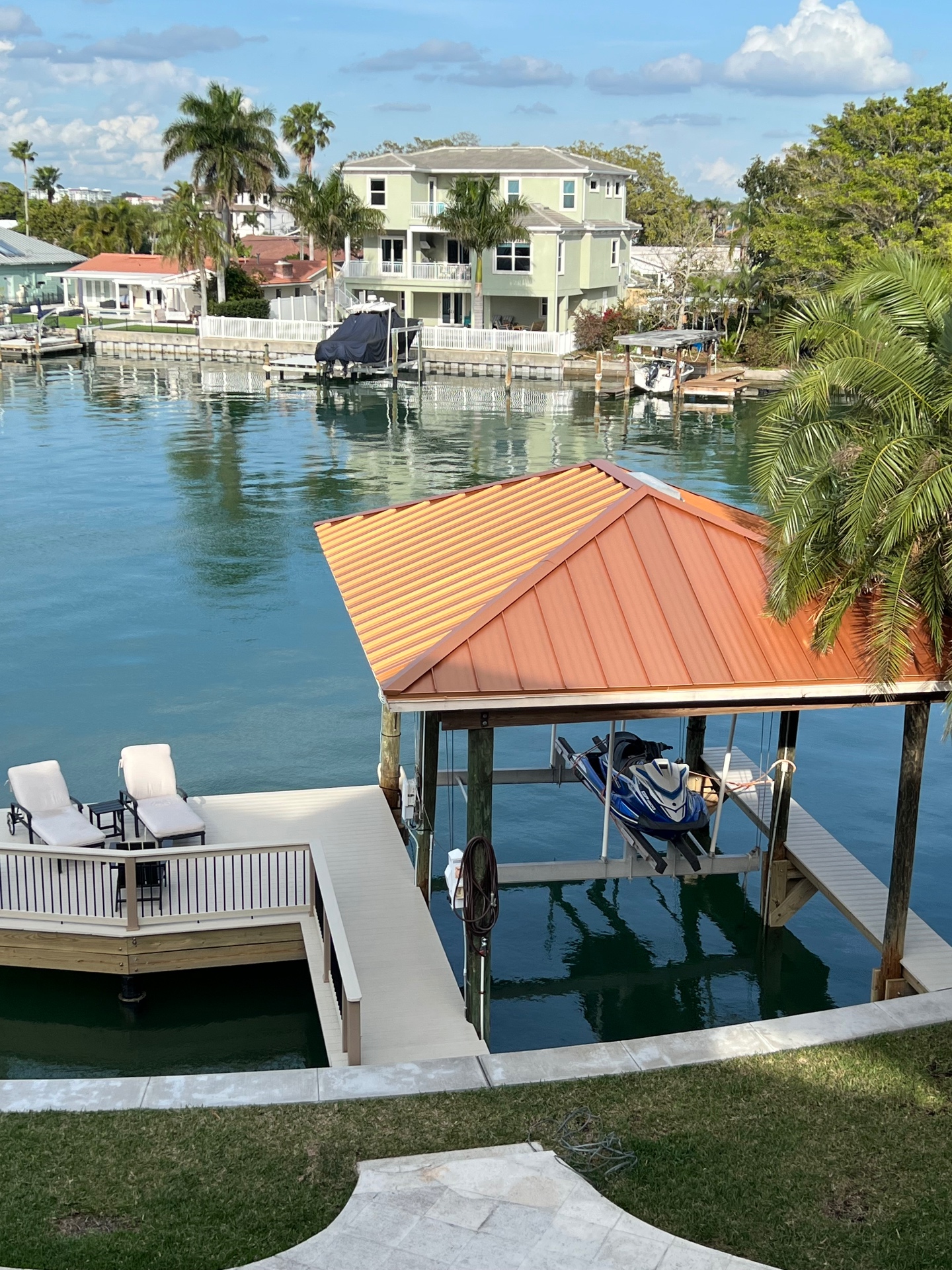 Boathouse with copper roof and jet-ski lift